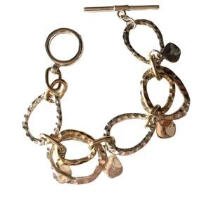 Mixed silver- and gold-tone hammered disc toggle clasp bracelet